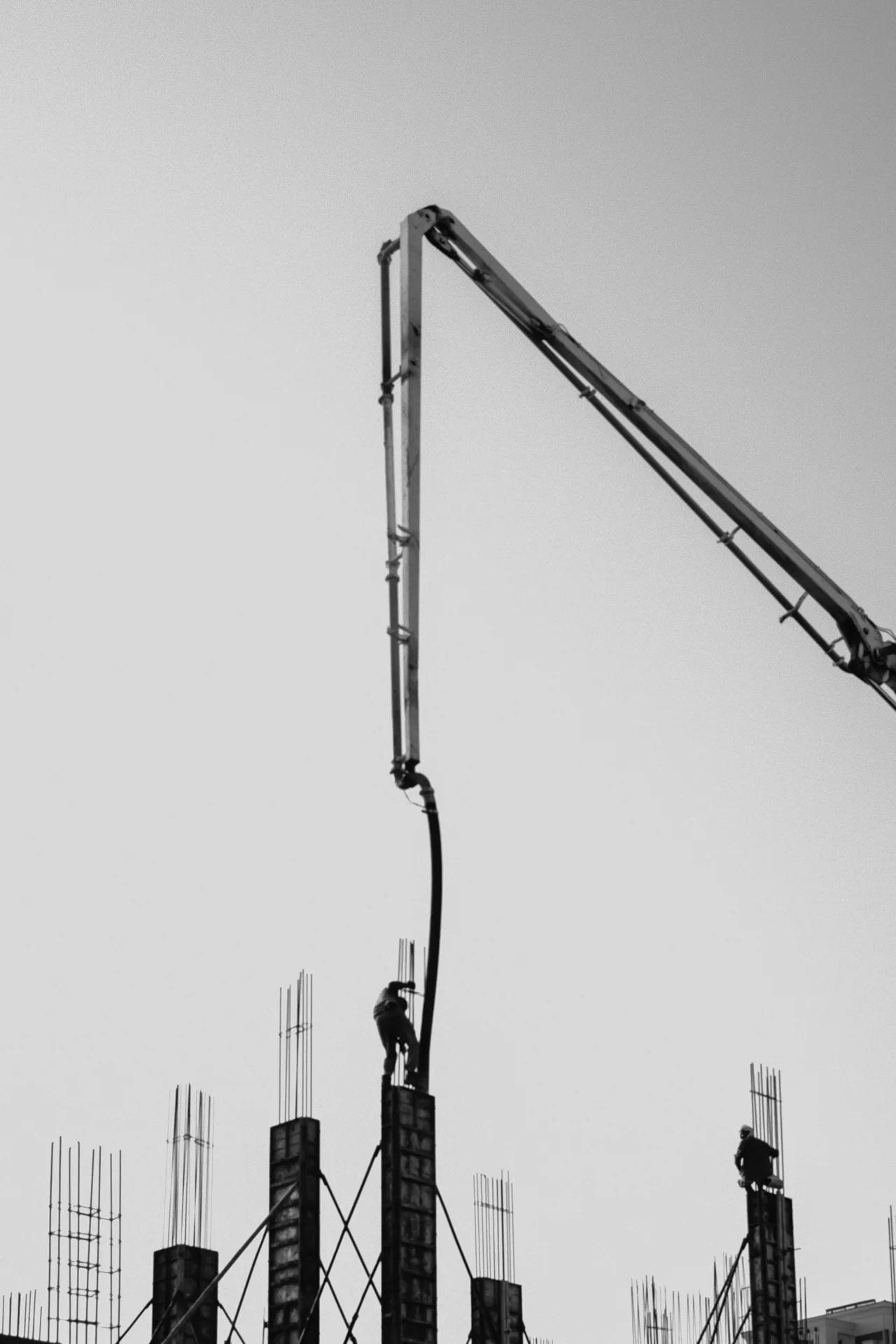 concrete pump and rebar on a tilt-up construction site in Detroit