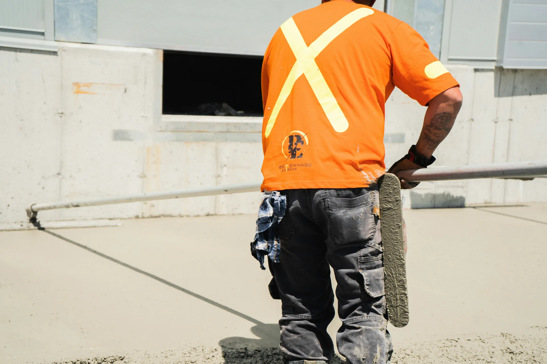 finisher working an Ardex application on a Detroit floor