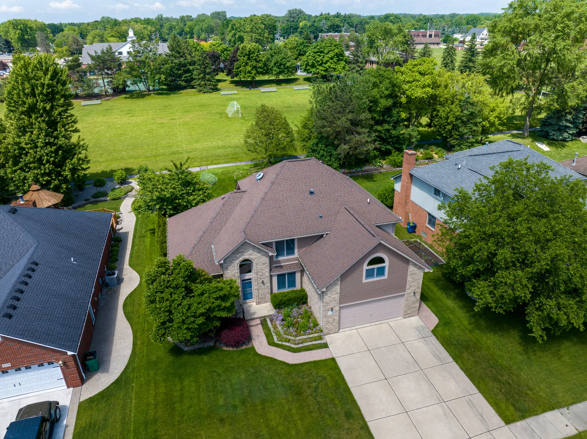aerial view of brushed-finish concrete driveways in a Detroit suburb