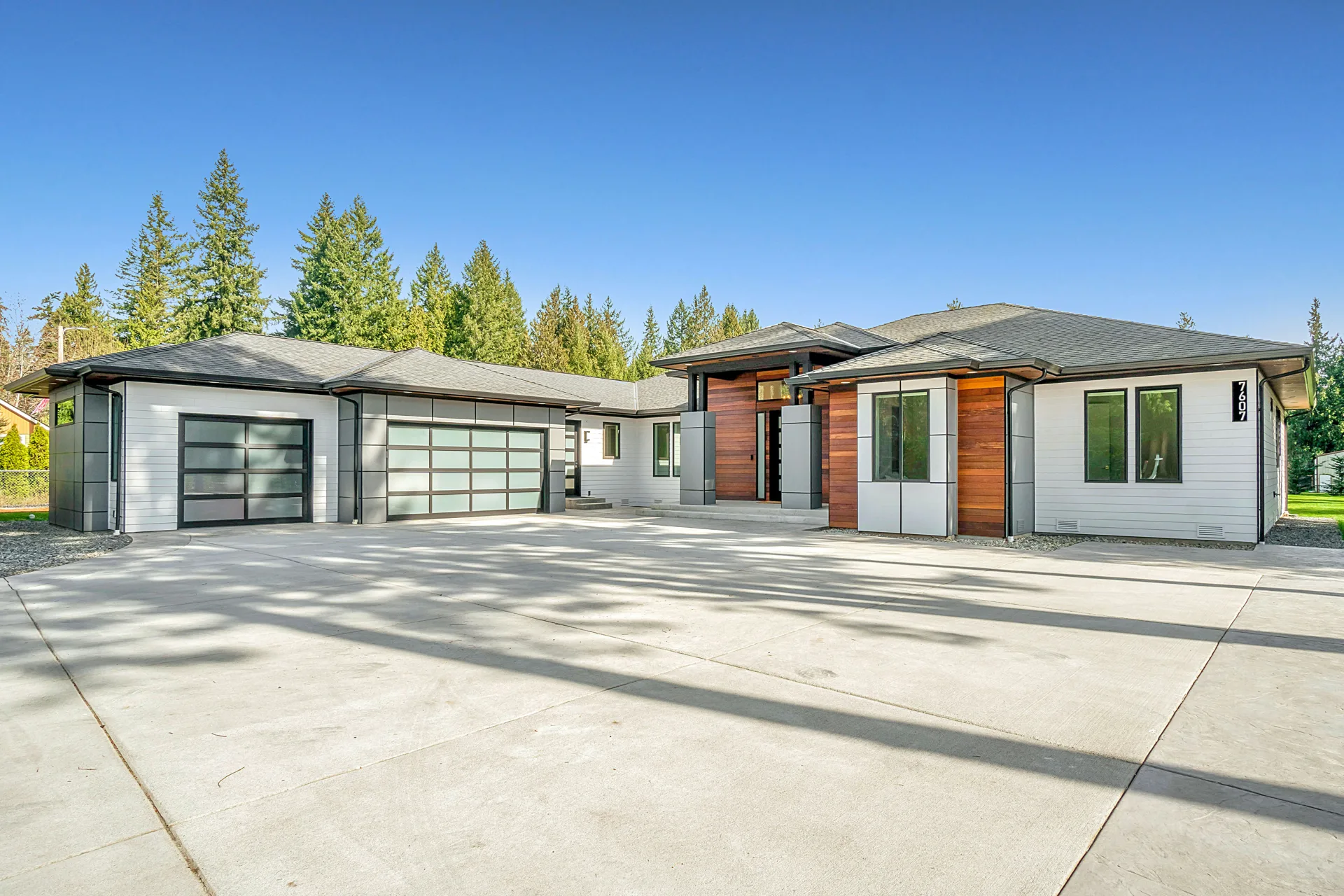 new concrete driveway at a modern three-car-garage Detroit home