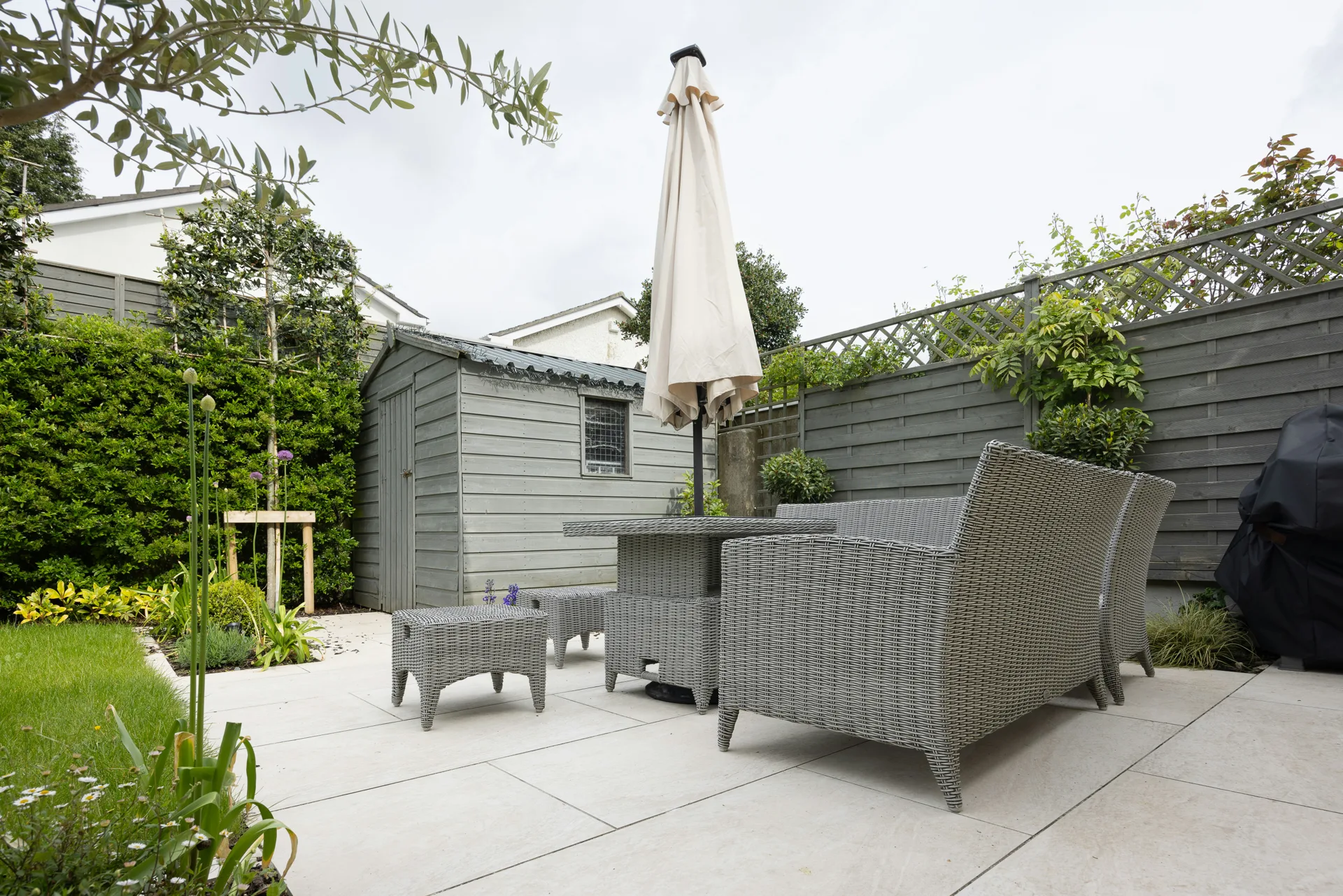 plain concrete patio in a Detroit garden setting