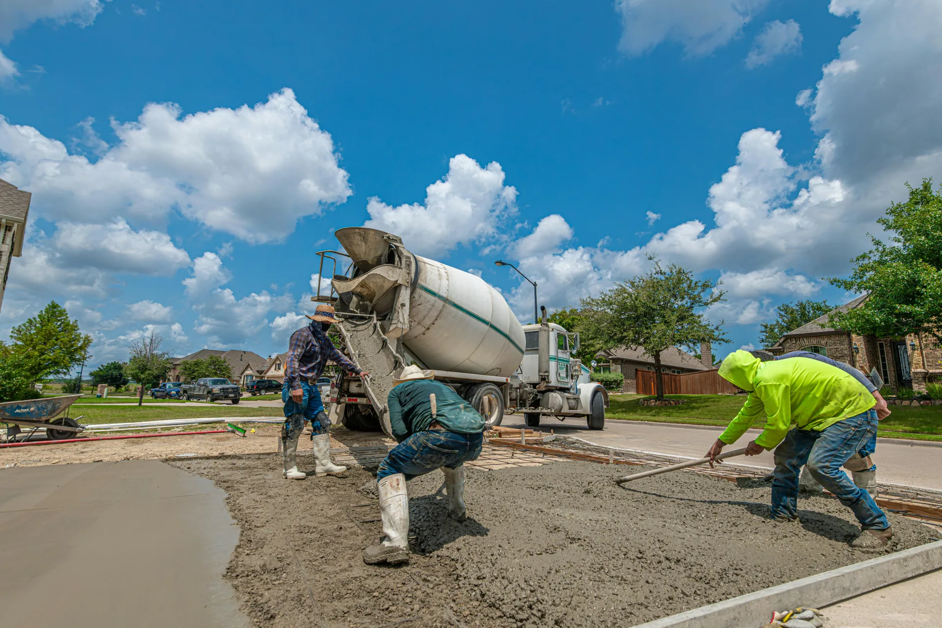 Detroit concrete crew finishing a fresh driveway pour