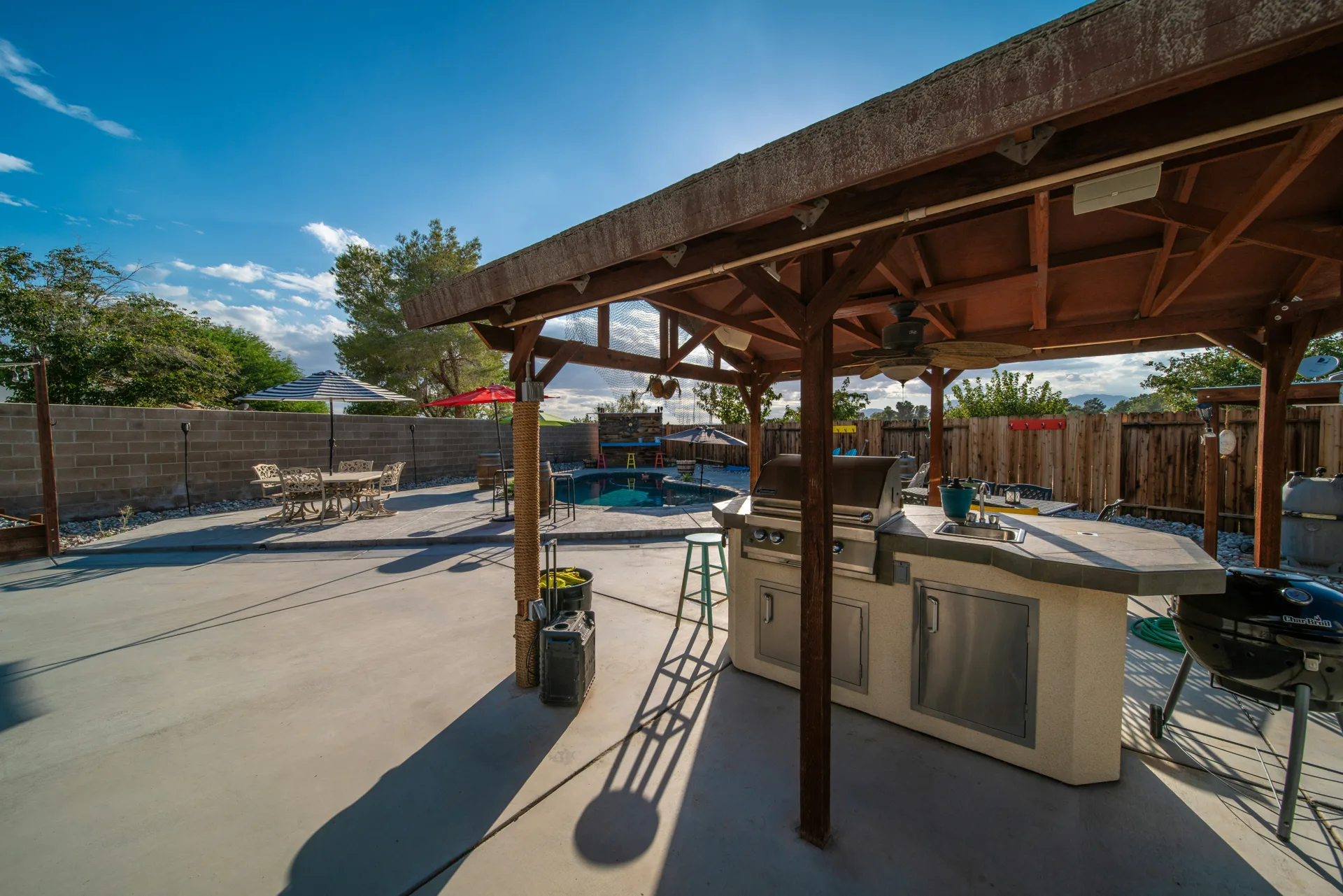 broom-finish concrete pad around a fire pit at a Detroit home