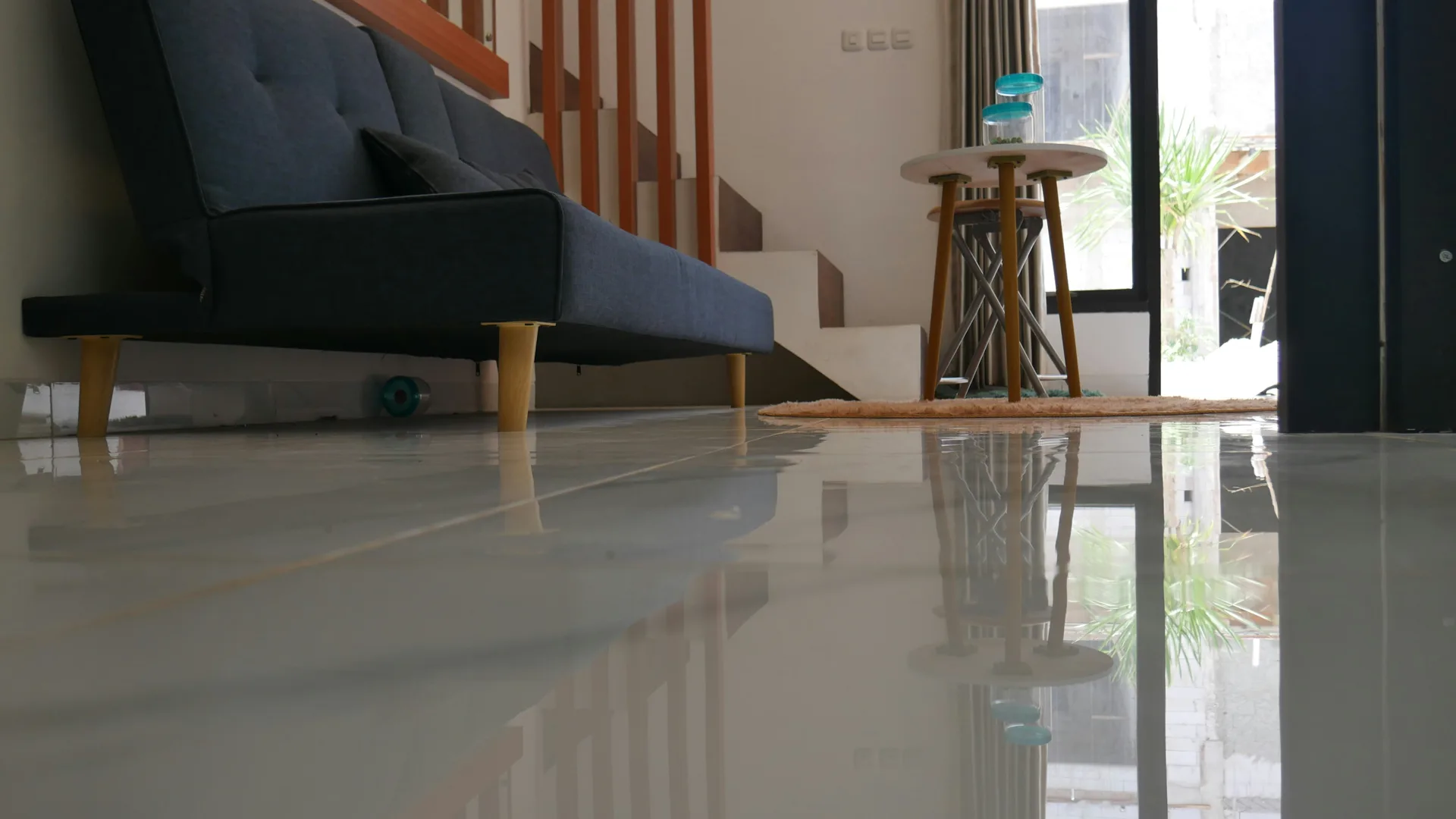polished concrete floor reflecting light in a Detroit living room