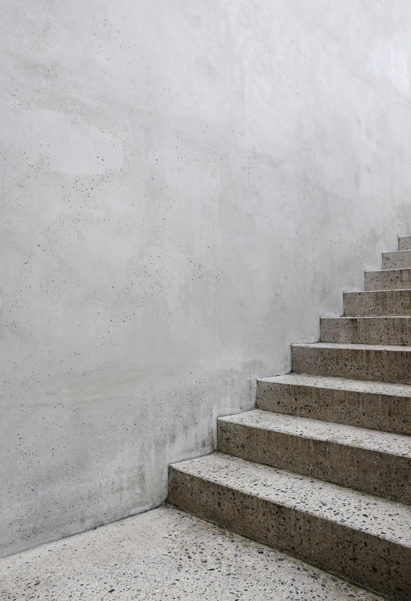 finished concrete front entry steps at a Detroit home in winter